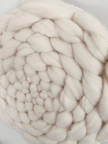 Off white fluffy circular wool weaving