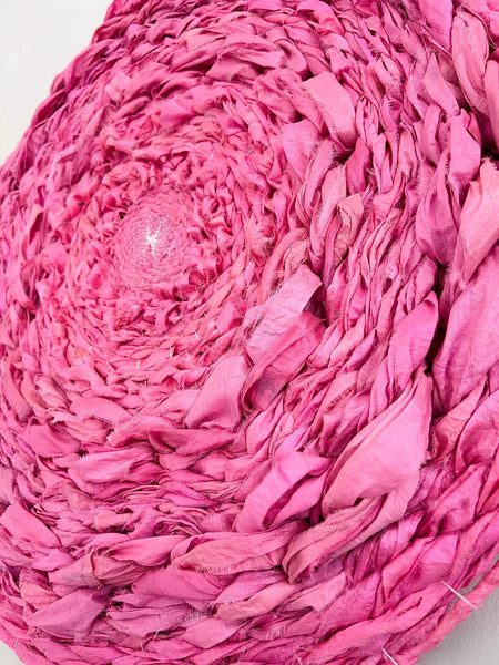 Calming pink silk circular weaving