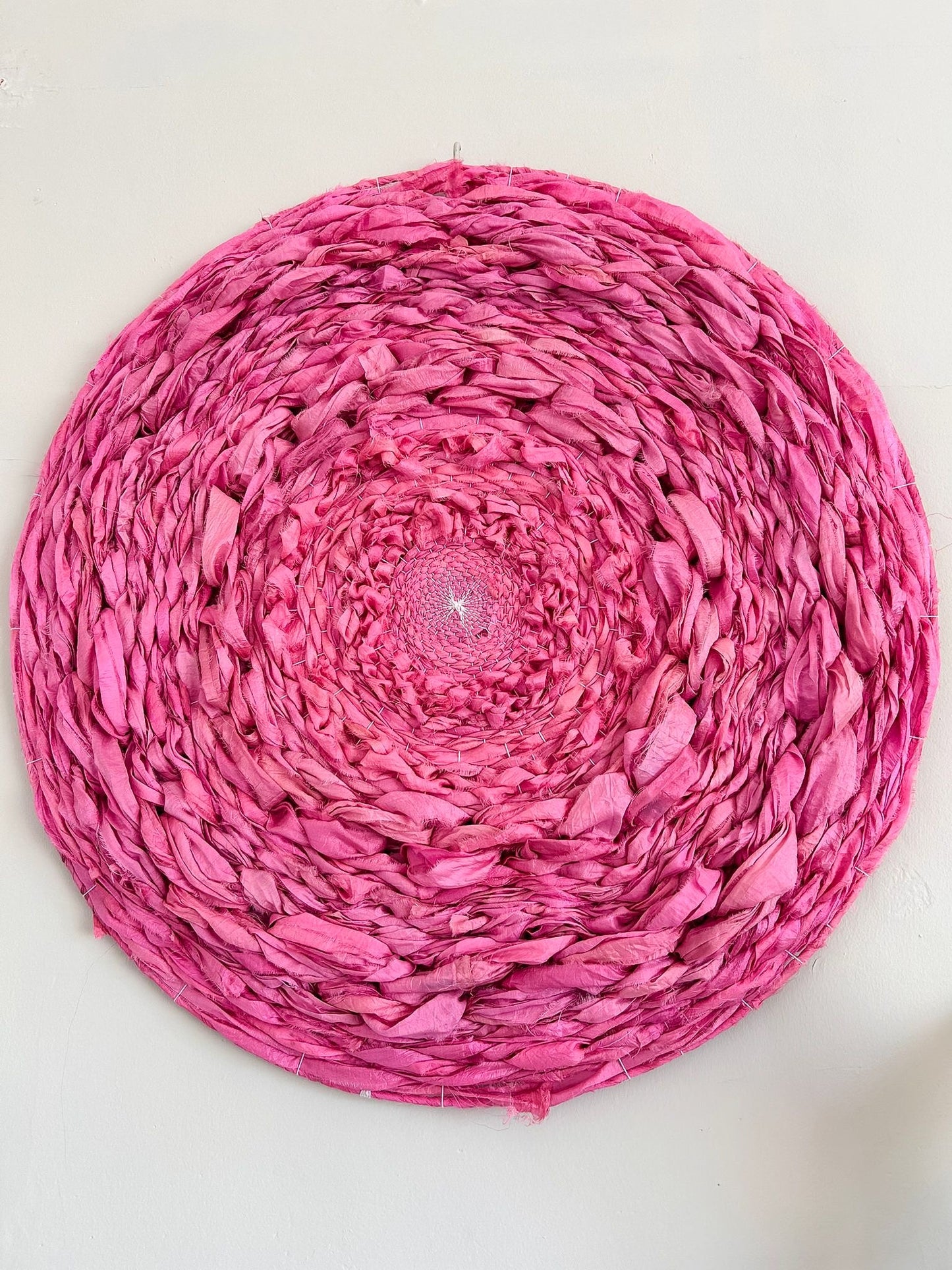 Calming pink silk circular weaving