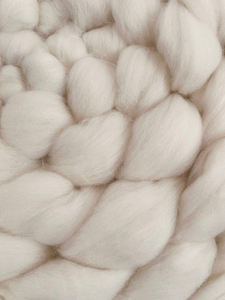 Off white fluffy circular wool weaving