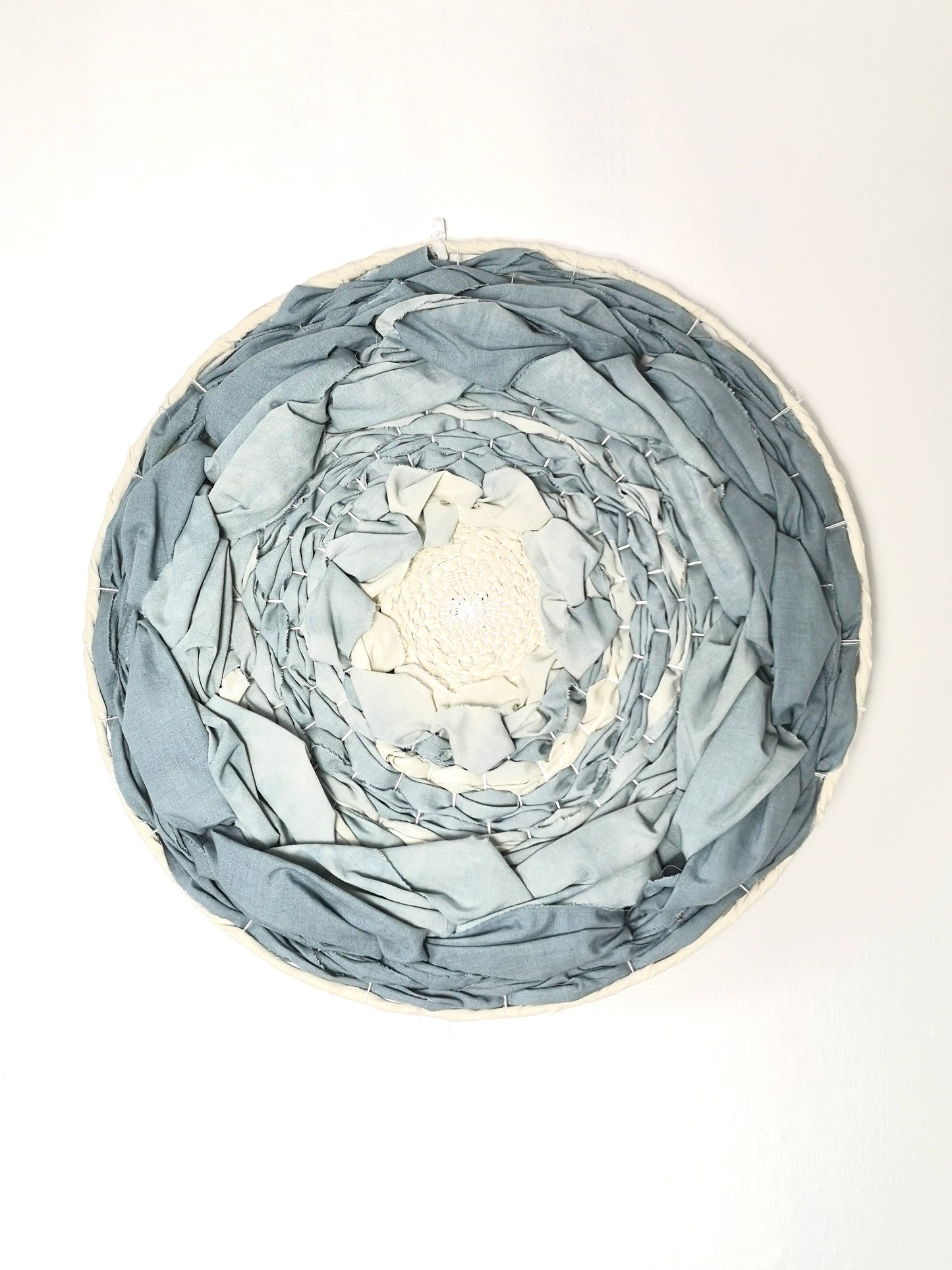 Blue dip dyed circular woven wall art