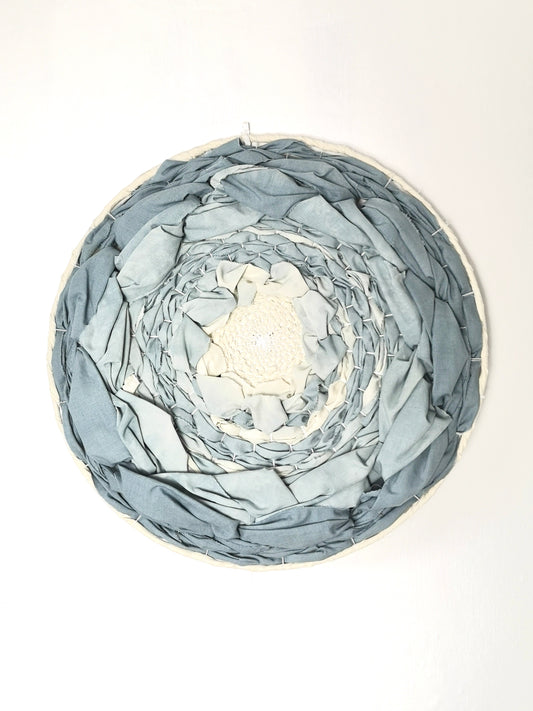 Blue dip dyed circular woven wall art