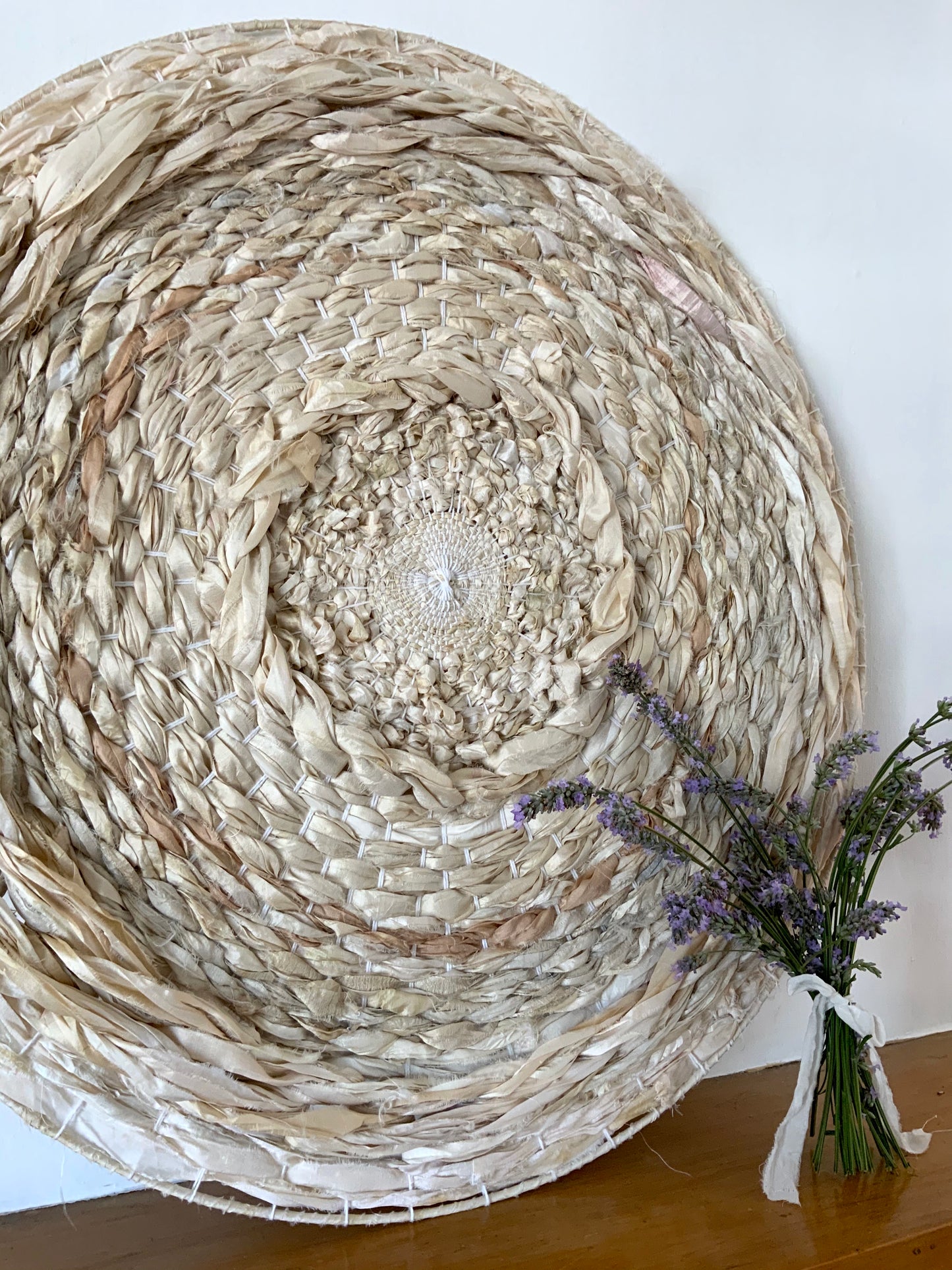 All silk neutral circular wall hanging or wedding backdrop