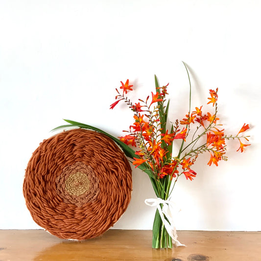 Vintage inspired rust tones circular wool wall hanging