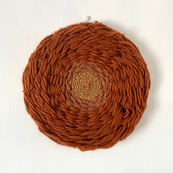 Vintage inspired rust tones circular wool wall hanging